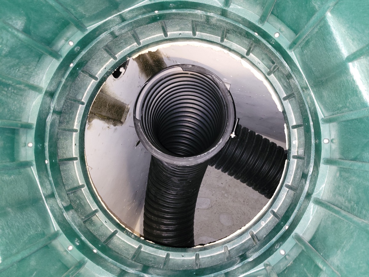 Anaerobic digester chamber with corrugated piping